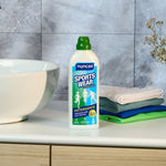 SPortswear Detergente per capi tecnici Nuncas - Immagine ambientata del prodotto posizionato in un bagno vicino al lavandino vicino a capi sportivi